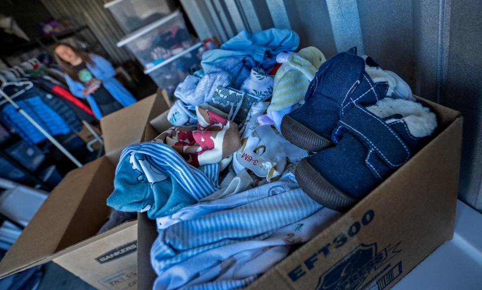 Donations of children's clothes and shoes are among the items handed out from the Grassroot Projects nonprofit Monday, Nov. 7, 2022 in Carmel. The small organization helps children of immigrant and refugee families.