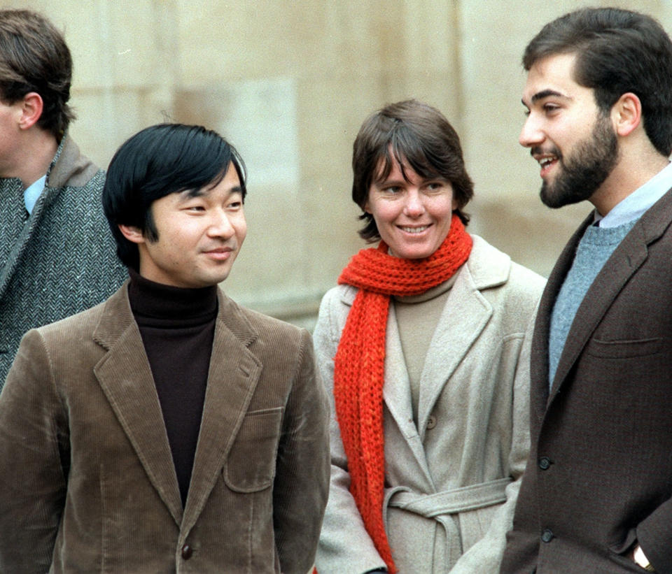 In this Dec. 1983, photo, then Prince Hiro, current Crown Prince Naruhito, left, chats with friend Keith George, right, at Merton College at Oxford in England. The two young men hit it off from the start, and George, a friend of Naruhito’s since their days at Oxford, remembers Naruhito both for his sense of humor and their shared love of music: George played blue grass and country music on the banjo, and Naruhito played the viola. (Kyodo News via AP)