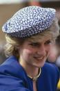 <p>In a blue-and-white patterned hat during a trip to Canada. </p>