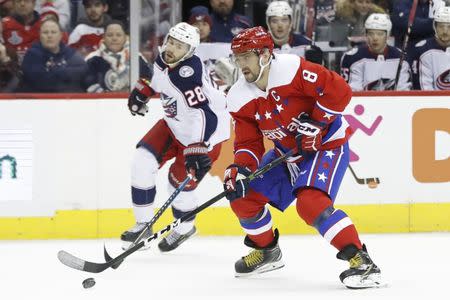 Jan 12, 2019; Washington, DC, USA; Washington Capitals left wing Alex Ovechkin (8) skates with the puck as Columbus Blue Jackets right wing Oliver Bjorkstrand (28) chases in the first period at Capital One Arena. Mandatory Credit: Geoff Burke-USA TODAY Sports