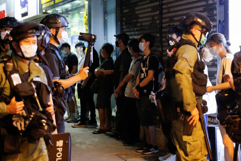 Protest to mark the first anniversary of an attack in a train station by an armed crowd wearing white shirts, demanding justice for the victims of violence and broader freedoms, at a shopping mall in Hong Kong's Yuen Long