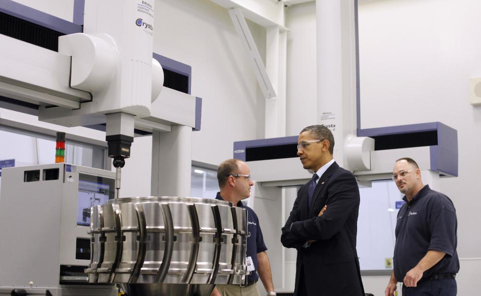 President Barack Obama, with employees Robert Abernathy, left, and Steven C. Morris, right, tours the Rolls-Royce Crosspointe jet engine disc manufacturing facility, Friday, March, 9, 2012, in Prince George, Va. Crosspoint facility manufactures precision-engineered engine disc and other components for aircrafts. (AP Photo/Pablo Martinez Monsivais)
