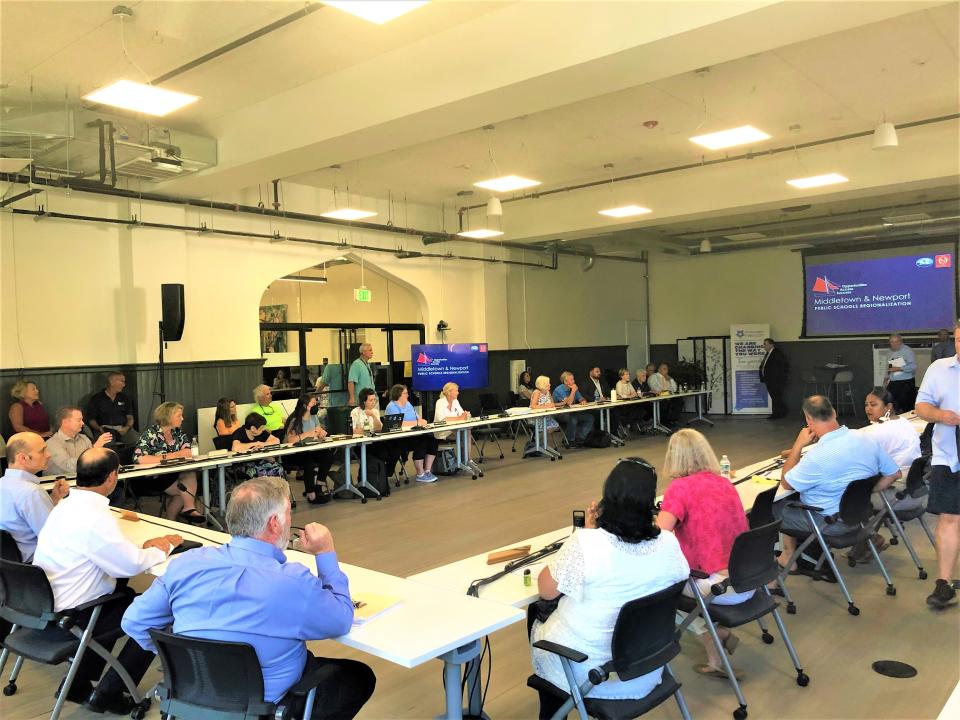 Members of the Newport City Council and School Committee, and Middletown Town Council and School Committee gathering at Innovate Newport on Wednesday, July 20 to discuss school regionalization.