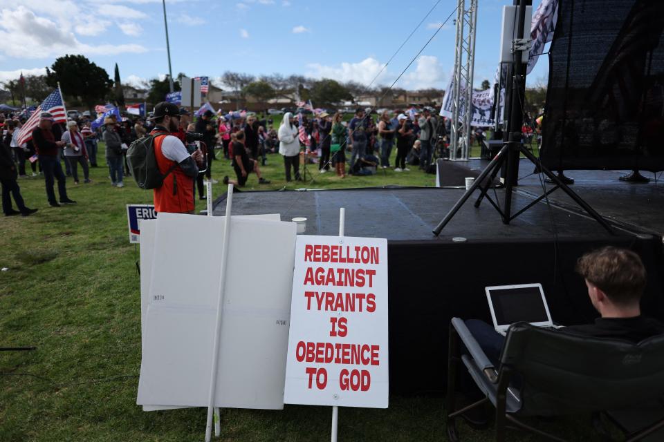 The scene at a Take Our Border Back Convoy gathering near the Mexico-U.S. border in San Ysidro, California, on Feb. 3, 2024. Experts say longstanding ideas about Christian nationalism have evolved into a new kind of political fervor.