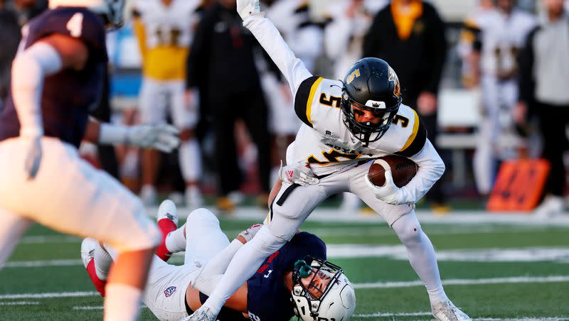 Woods Cross’ Isaac Johnson tries in vain to stop Roy’s Robert Young as they play at Woods Cross High School on Friday, Sept. 22, 2023.