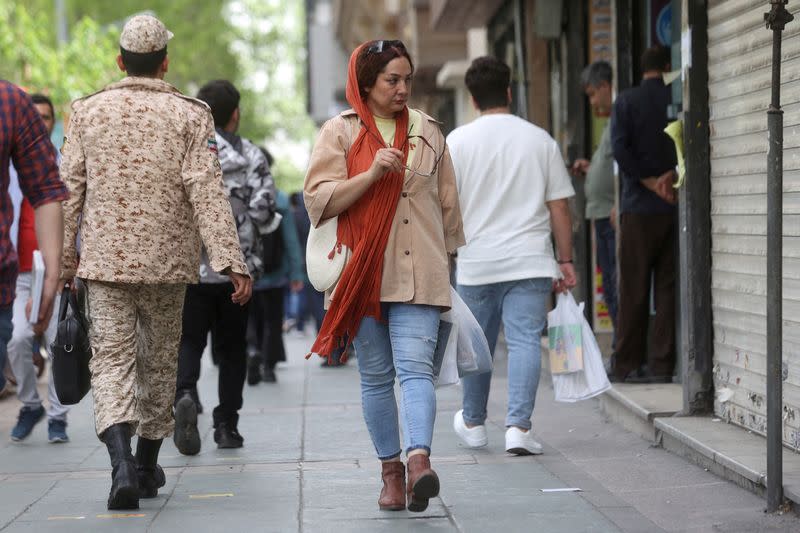 FILE PHOTO: An Iranian woman walks in a street in Tehran