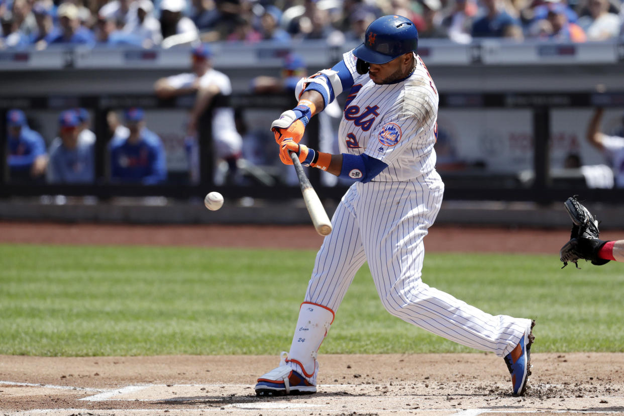 New York Mets' Robinson Cano hits a single off Cincinnati Reds starting pitcher Tyler Mahle during the first inning of a baseball game, Thursday, May 2, 2019, in New York.(AP Photo/Julio Cortez)