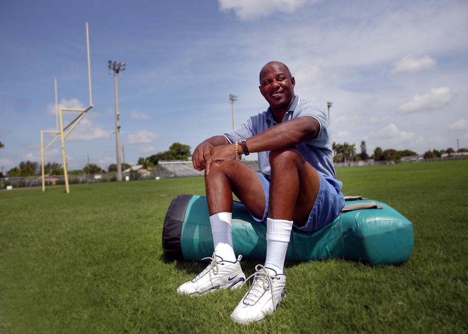 Anthony Carter visits his old playing field at Suncoast High School in Riviera Beach in 2002, the year he was inducted into the Palm Beach County Sports Hall of Fame. Post file photo