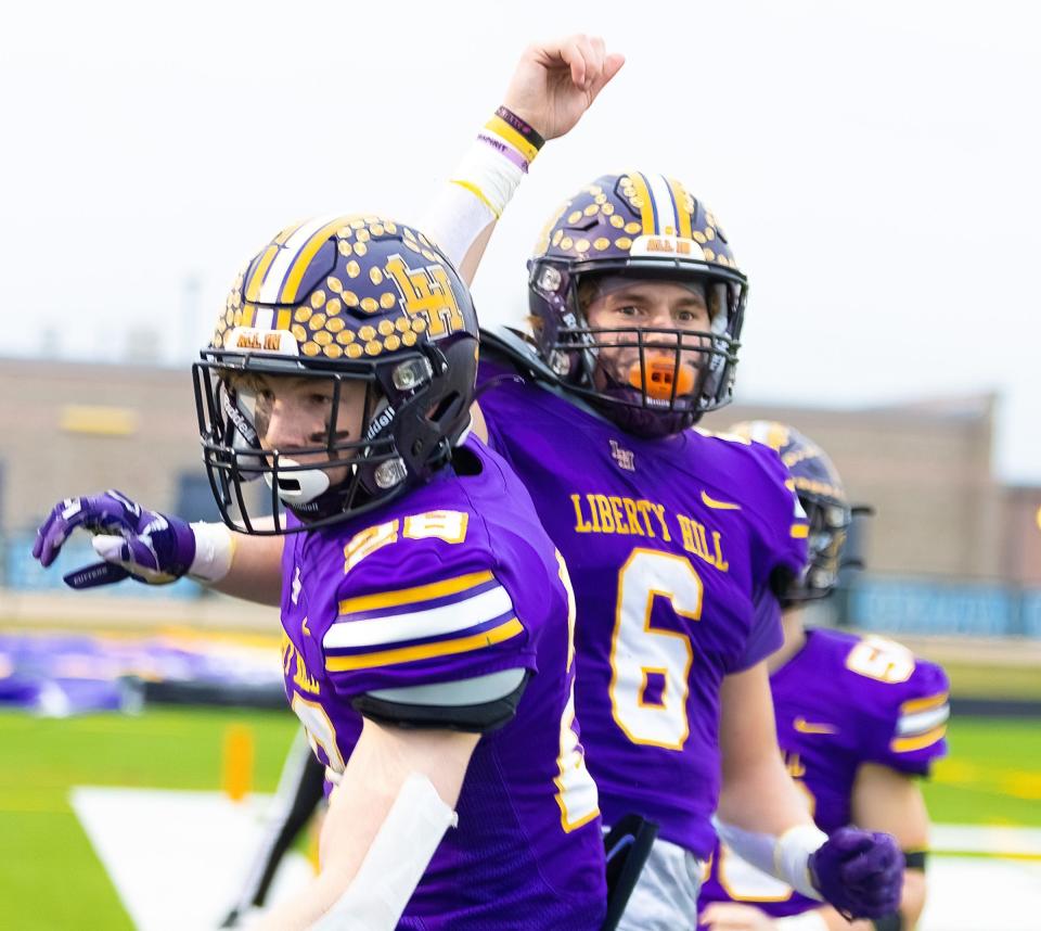 Liberty Hill running back Joe Pitchford, right, celebrating a touchdown with Ben Carter on Friday against Alamo Heights, broke his collarbone in the sixth week of the season but returned for the team's second playoff game.