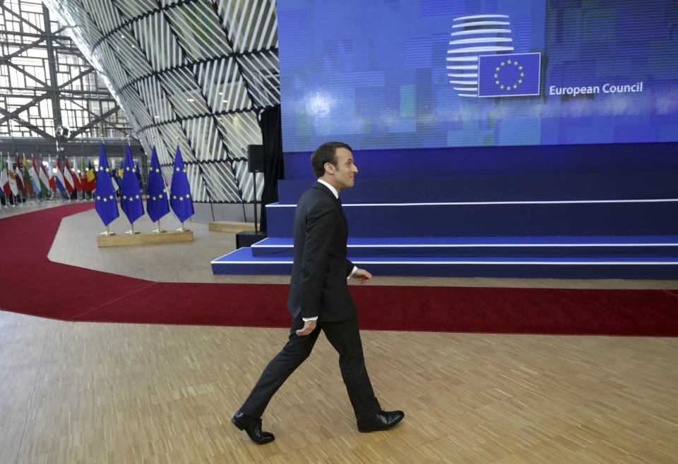 French President Emmanuel Macron arrives for an EU summit in Brussels, Thursday, March 21, 2019. British Prime Minister Theresa May is trying to persuade European Union leaders to delay Brexit by up to three months, just eight days before Britain is scheduled to leave the bloc. (AP Photo/Olivier Matthys)