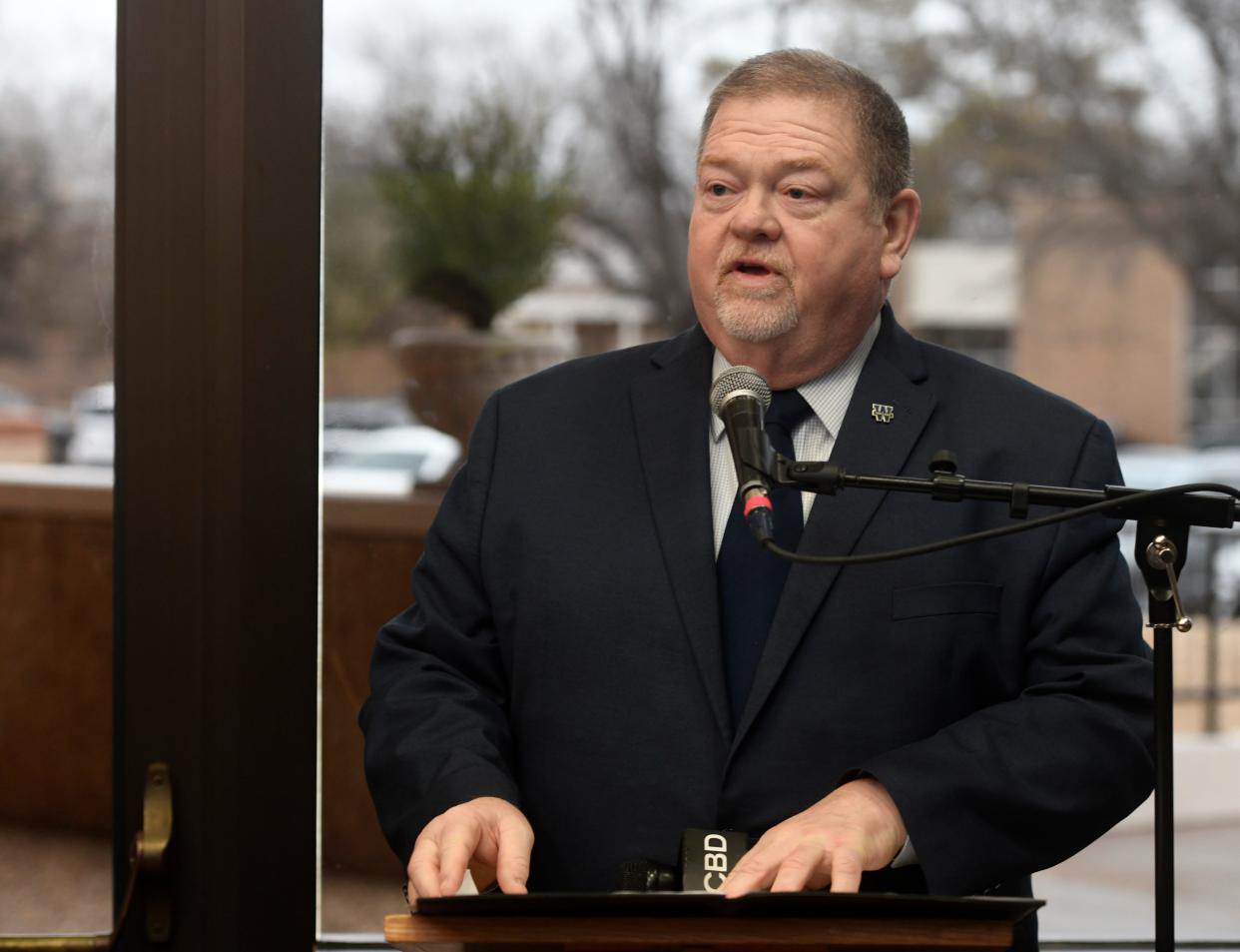 Wayland Baptist University president Bobby Hall gives opening remarks at the Flying Queens Museum on Feb. 18 in Plainview. Hall announced on Friday his plans to retire from the university in 2024.