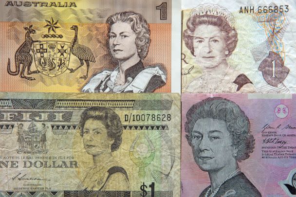 PHOTO: PPortraits of Queen Elizabeth on old one dollar ($1) paper banknotes of Australia, New Zealand and Fiji and on the current five dollar ($5) polymer banknote of Australia. (Simon Mcgill/Moment Editorial/Getty Images)