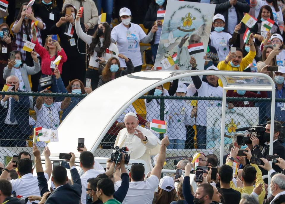 Pope Francis arrives on the popemobile to celebrate mass at the Franso Hariri Stadium in Irbil, Kurdistan Region of Iraq, Sunday, March 7, 2021.