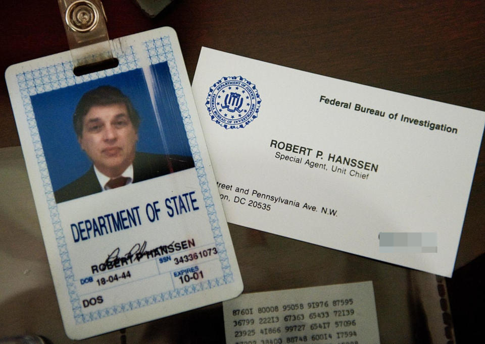 Department of State ID card and FBI business card of Robert P. Hanssen, Special Agent and Unit Chief, displayed on a surface