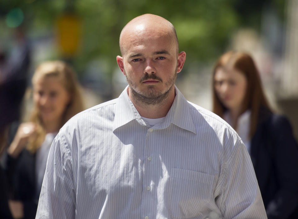 FILE - In this June 11, 2014 file photo, former Blackwater Worldwide guard Nicholas Slatten leaves federal court in Washington, after the start of his first-degree murder trial. A federal judge has sentenced a former Blackwater security contractor to life in prison for his role in the 2007 shooting of unarmed civilians in Iraq. (AP Photo/Cliff Owen)