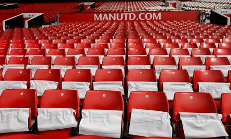 Football Soccer - Manchester United v Everton - Barclays Premier League - Old Trafford - 3/4/16 Tributes placed on seats to mark the 60th anniversary of the debut of Sir Bobby Charlton before the game Action Images via Reuters / Jason Cairnduff Livepic EDITORIAL USE ONLY.