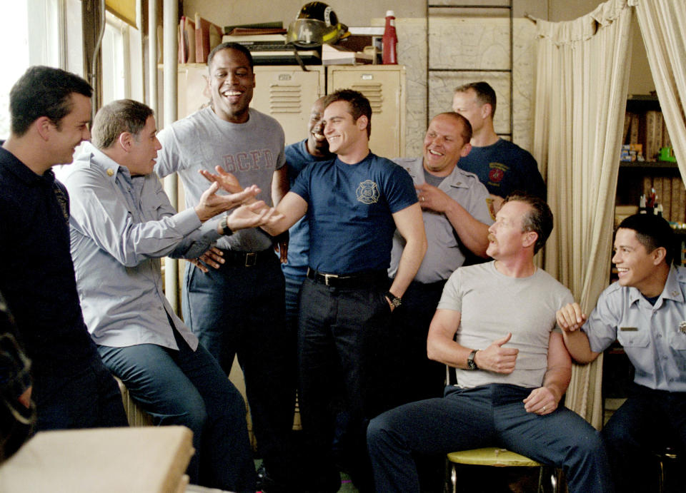 From l to r: Balthazar Getty, John Travolta, Kevin Daniels, Morris Chestnut, Kevin Chapman, Robert Lewis, Robert Patrick and Hernandez in Ladder 49. (Photo: ©Buena Vista Pictures/Courtesy Everett Collection)