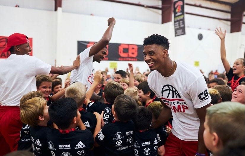 Jarrett Culver (center) celebrates with participants Wednesday, July 14, 2021, during his Jarrett Culver Camp held at the Apex Event Center in Lubbock.