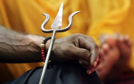 Files photo of an Indian Hindu sadhu (holyman) holding a trident during a protest in New Delhi August 2, 2006. REUTERS/Adnan Abidi/Files
