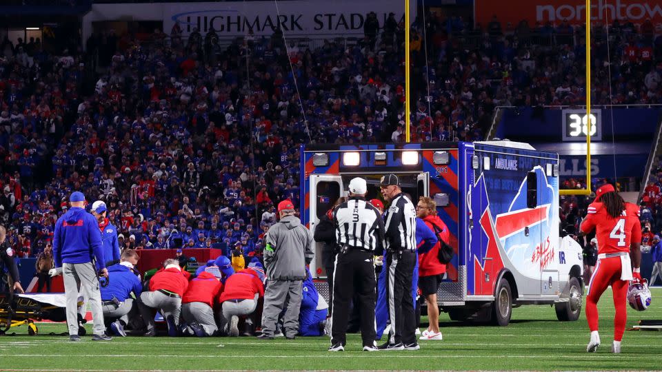 An ambulance waits as medical staff attend to Harris during the game against the Giants. - Jeffrey T. Barnes/AP