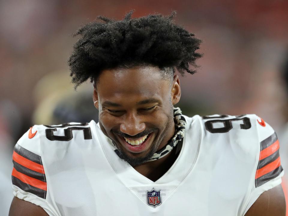 Cleveland Browns defensive end Myles Garrett (95) laughs on the sideline during the second half of an NFL preseason football game against the Cleveland Browns, Saturday, Aug. 27, 2022, in Cleveland, Ohio.