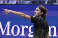 Stefanos Tsitsipas, of Greece, speaks with an official during a match with Carlos Alcaraz, of Spain, during the third round of the US Open tennis championships, Friday, Sept. 3, 2021, in New York. (AP Photo/Seth Wenig)