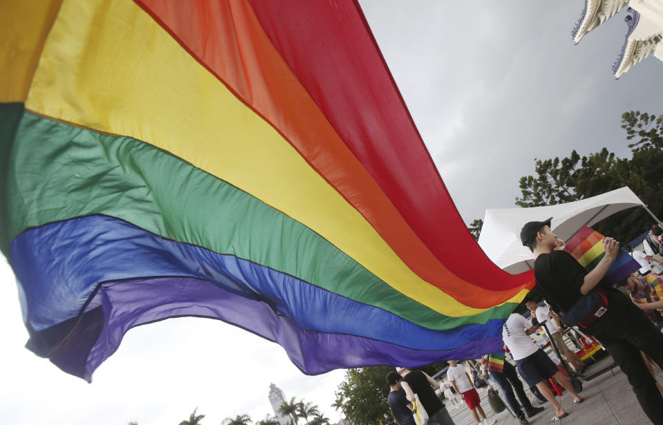 Participants march during the "Taiwan Pride March for the World!" at Liberty Square at the CKS Memorial Hall in Taipei, Taiwan, Sunday, June 28, 2020. This year marks the first Gay Pride march in Chicago 1970, and due to the COVID-19 lockdown, Taiwan is one of the very few countries to host the world's only physical Gay Pride. (AP Photo/Chiang Ying-ying)