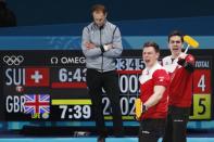 Curling - Pyeongchang 2018 Winter Olympics - Men’s Tie-Breaker - Switzerland v Britain - Gangneung Curling Center - Gangneung, South Korea - February 22, 2018 - Claudio Patz and Peter de Cruz of Switzerland react next to Thomas Muirhead of Britain. REUTERS/Cathal McNaughton