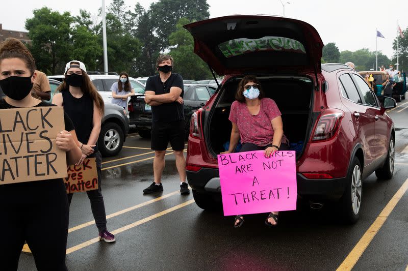 Students protest outside Groves High School in support of a fellow student who was jailed in a Detroit suburb