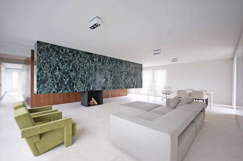 Inspired by Ludwig Mies Van Der Rohe’s onyx wall in Villa Tugendhat, architects Tom De Meester and Tine Vliegen of De Meester Vliegen designed this three-ton Verde Patricia marble hanging cabinet in an apartment in Antwerp, Belgium.