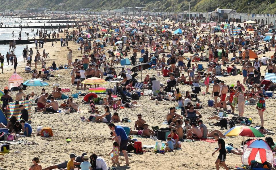 Large crowds of people seen near Bournemouth Pier on May 25. Source: AFP via Getty Images