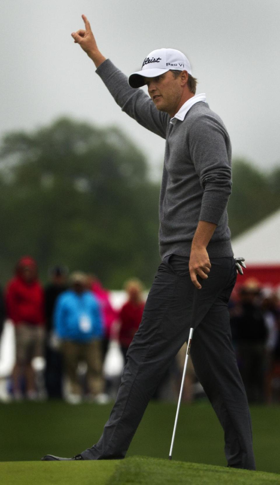 Matt Jones celebrates after a birdie on the 18th hole during the third round of the Houston Open golf tournament on Sunday, April 6, 2014, in Humble, Texas. (AP Photo/Patric Schneider)