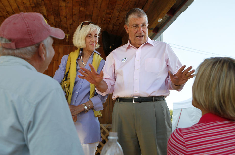 FILE- Former independent gubernatorial candidate Eliot Cutler campaigns with his wife, Melanie Cutler on Aug. 13, 2010, in Topsham, Maine. Maine State Police have executed search warrants at two homes belonging to Cutler. (AP Photo/Robert F. Bukaty, File)