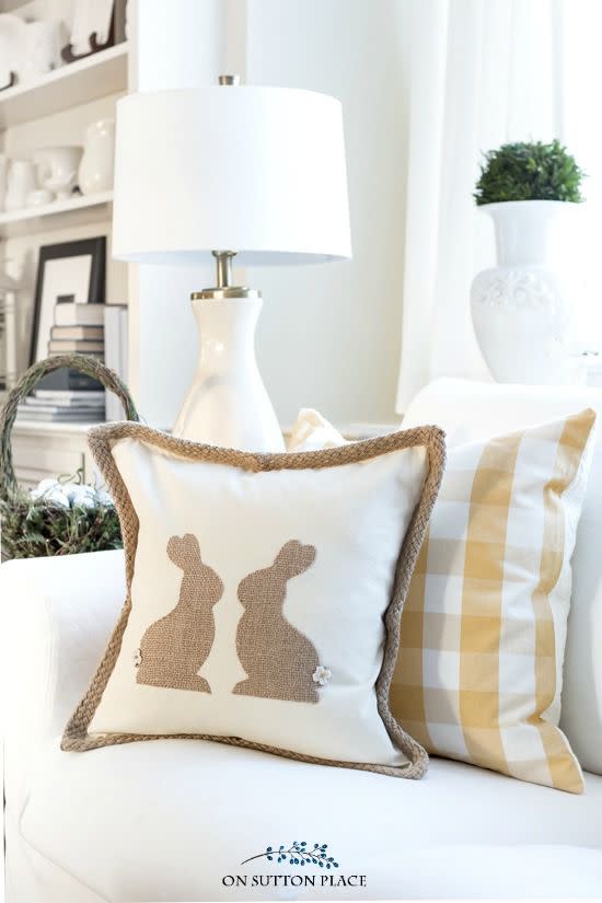 <p>No sewing skills are necessary to bring this cozy couch accessory to life. </p><p><strong>Get the tutorial at <a rel="nofollow noopener" href="https://www.onsuttonplace.com/diy-burlap-easter-bunny-pillow/" target="_blank" data-ylk="slk:On Sutton Place" class="link ">On Sutton Place</a>. </strong></p><p><strong><a rel="nofollow noopener" href="https://www.amazon.com/Fabric-Editions-MDGB-BUR5-24-Inch-Natural/dp/B004BPEAWO/" target="_blank" data-ylk="slk:SHOP BURLAP" class="link ">SHOP BURLAP</a><br></strong></p>