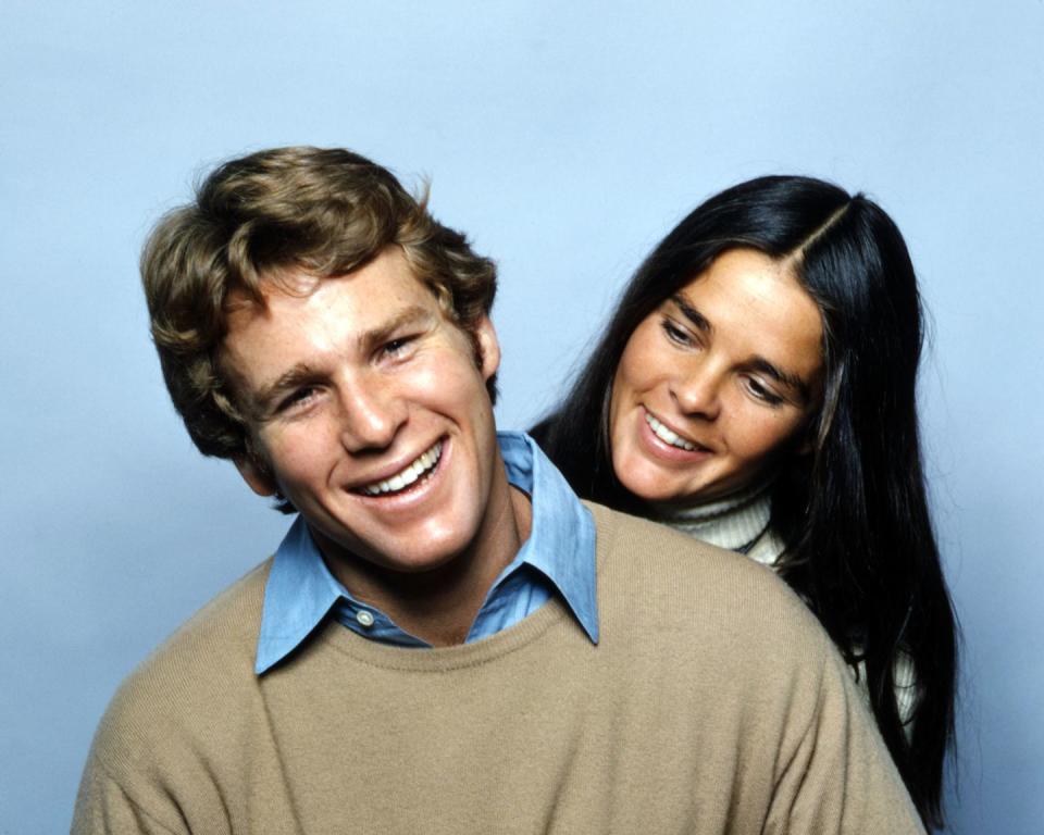 ryan o neal and ali macgraw smiling in a promo photo for love story