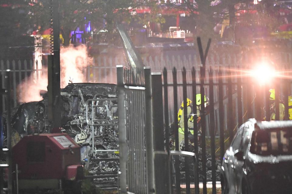 Emergency services work at the scene on the wreckage of a helicopter that crashed in a car park outside Leicester City Football Club's King Power Stadium: AFP/Getty Images