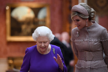 Britain's Queen Elizabeth accompanies Queen Maxima of the Netherlands as they view Dutch items from the Royal Collection, during a state visit, at Buckingham Palace in London, Britain October 23, 2018. Chris J Ratcliffe/Pool via REUTERS