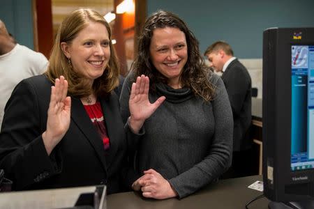 Jennifer Bersdale (L) and Rachael Bersdale apply for a marriage license at City Hall in St. Louis, Missouri November 5, 2014. REUTERS/Whitney Curtis