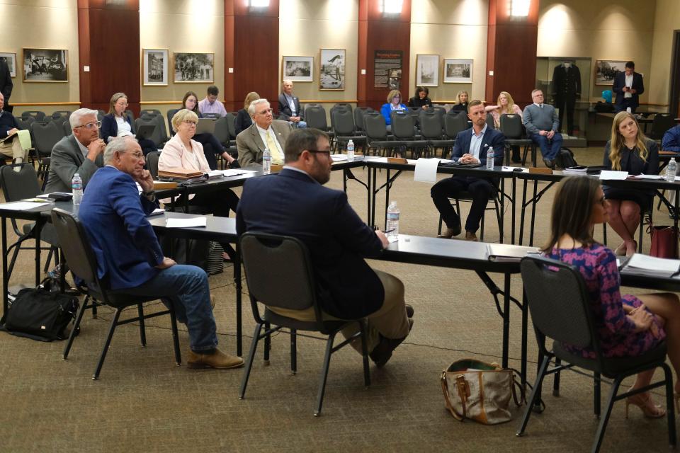 The Oklahoma Statewide Virtual Charter School Board listens to public comment on April 11 on a Catholic virtual charter school during a meeting at the Oklahoma History Center. The board voted 3-2 in June to approve the creation of the school.