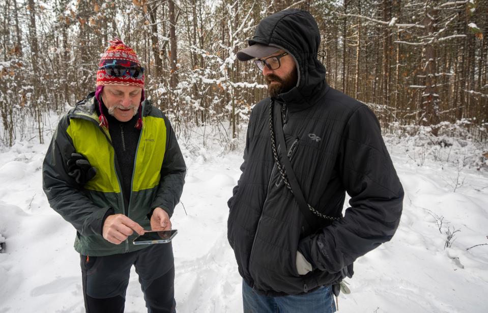 Clint Miller, left, the central midwest regional director for The Conservation Fund, speaks with Charlie Carlin, director of strategic initiatives at Gathering Waters: Wisconsin's Alliance for Land Trusts, are shown Thursday, December 29, 2022 in the Pelican River Forest between Rhinelander and Crandon, Wis. It is bisected by Highway 8 east of Rhinelander and straddles the Great Lakes and Mississippi River watersheds.In October, the Wisconsin Natural Resources Board signed off on a $15.5 million conservation easement for more than 56,000 acres in northern Wisconsin.It is the largest land conservation effort in state history.