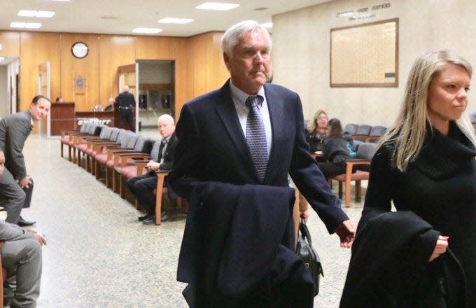 James Krauseneck, 67, arrives at court with his daughter Sara, right on Nov. 8, 2019