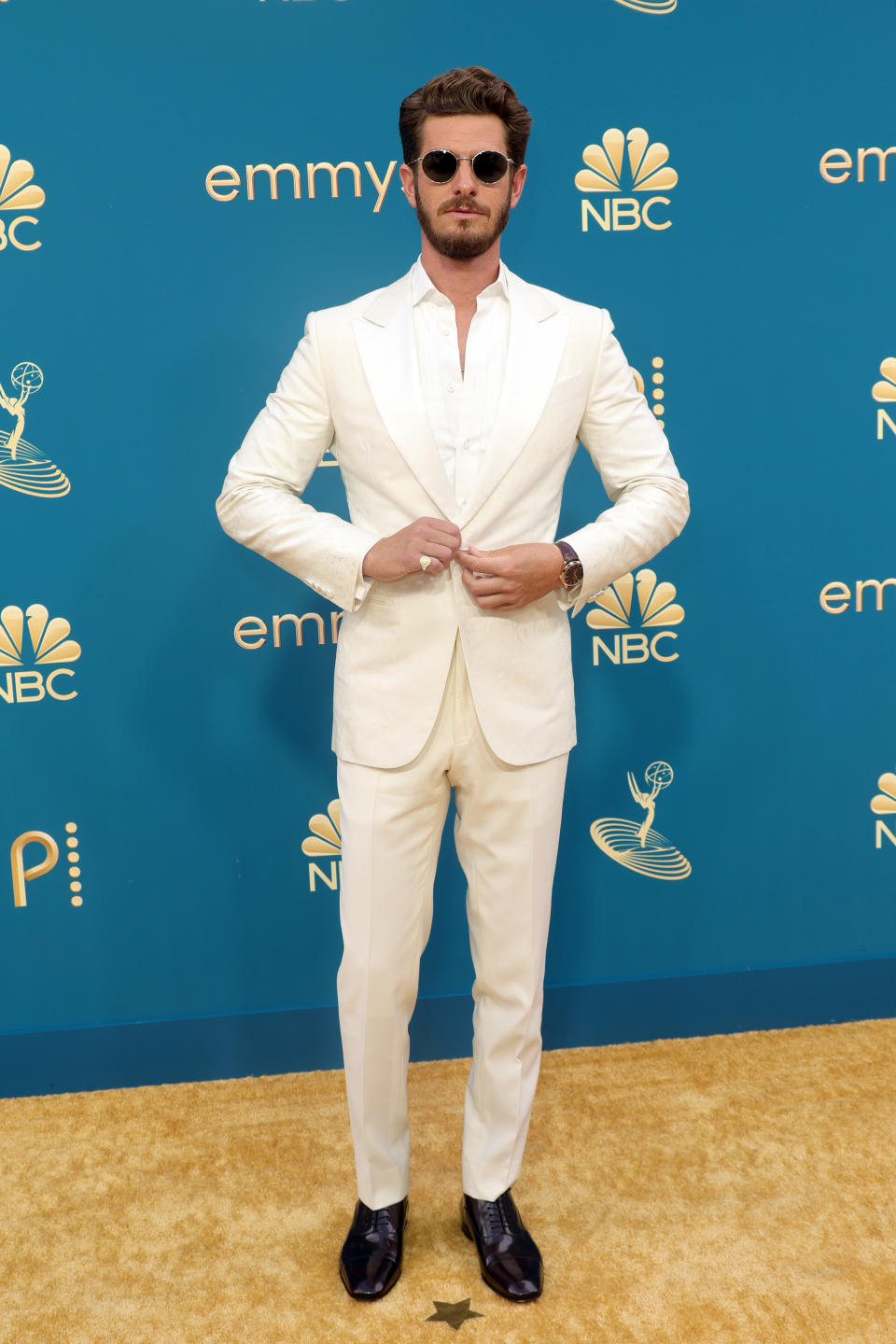 Andrew Garfield in a Zegna suit with Christian Louboutin lace-up shoes. - Credit: Getty Images