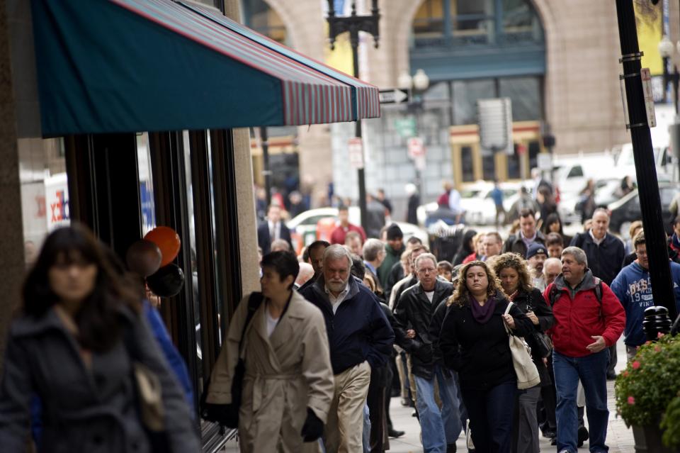 BOSTON - OCTOBER 29:  Commuters make their way through downtown Boston's financial district during morning rush hour on Thursday, October 29, 2009.  (Photo by Sarah Beth Glicksteen/The Christian Science Monitor/Getty Images)