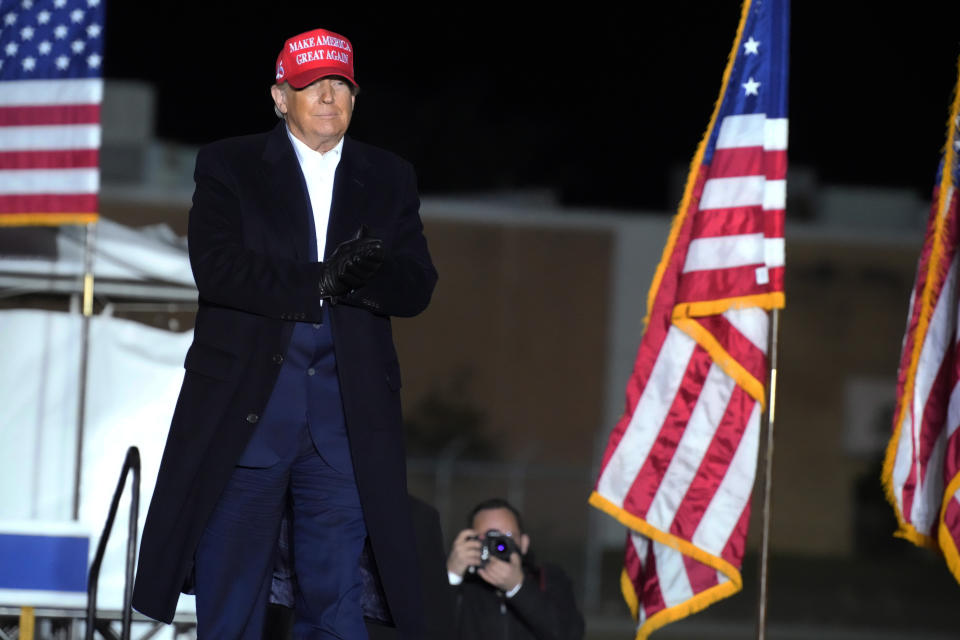 Former President Donald Trump arrives at a rally, Saturday, March 12, 2022, in Florence, S.C. Trump has endorsed two Republicans mounting primary challenges to sitting House members who have been critical of him. (AP Photo/Meg Kinnard)