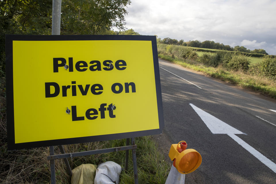 Please Drive on Left signs and arrows have been placed on the B4031 road outside RAF Croughton, in Northamptonshire, where Harry Dunn, 19, died when his motorbike was involved in a head-on collision in August.