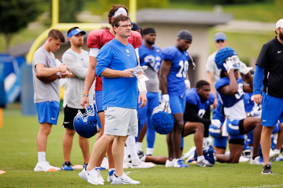 Kentucky offensive coordinator Rich Scangarello watches a play during the Kentucky Football Fan Day open practice on Saturday, Aug. 6, 2022, at Joe Craft Football Training Center in Lexington, Kentucky.