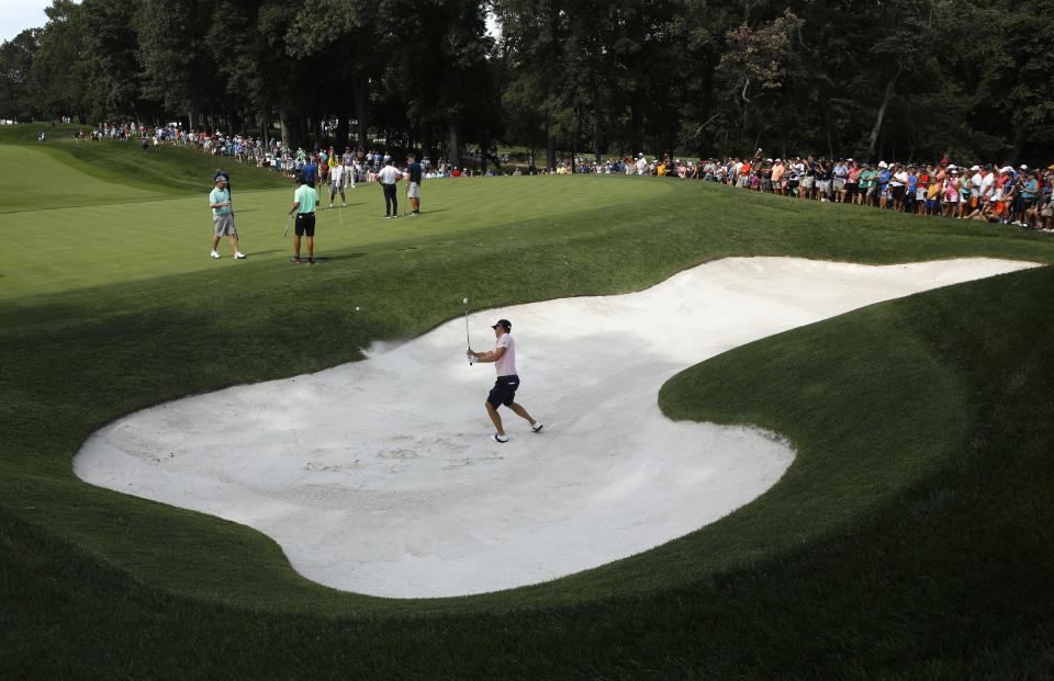 Justin Thomas hits out of a bunker on the 15th hole during a practice round for the PGA Championship golf tournament at Bellerive Country Club, Wednesday, Aug. 8, 2018, in St. Louis. (AP Photo/Charlie Riedel)