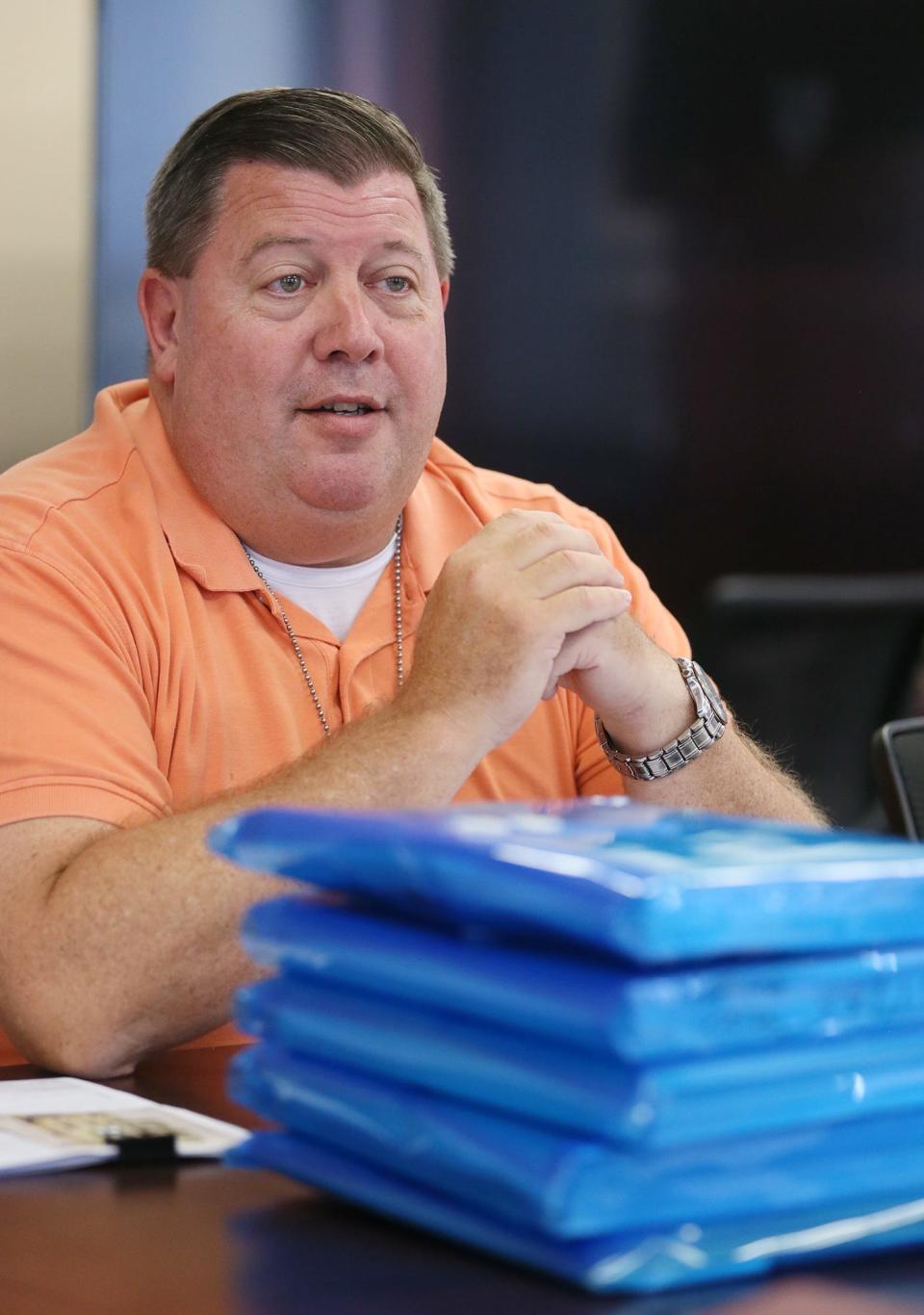 Detective Jim Pasheilich talks about unresolved cases in the conference room of the Akron Police Department in the Harold K. Stubbs Justice Center in Akron.