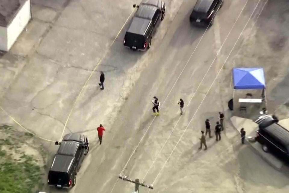 In this image taken from video provided by KTLA, law enforcement personnel work at the scene following an explosion during an indoor training exercise, Wednesday, March 13, 2024, in Irvine, Calif. An explosion during an indoor training exercise Wednesday sent 16 members of Southern California's Orange County Sheriff’s Department SWAT team to the hospital, with one person requiring surgery for a leg injury, the department said. (KTLA via AP)