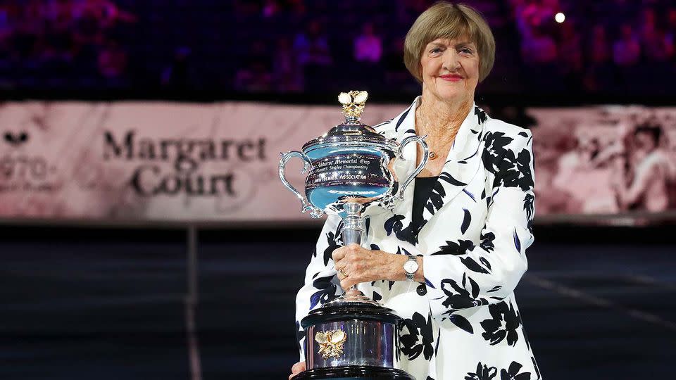 Margaret Court holds a trophy at the Australian Open in 2020.